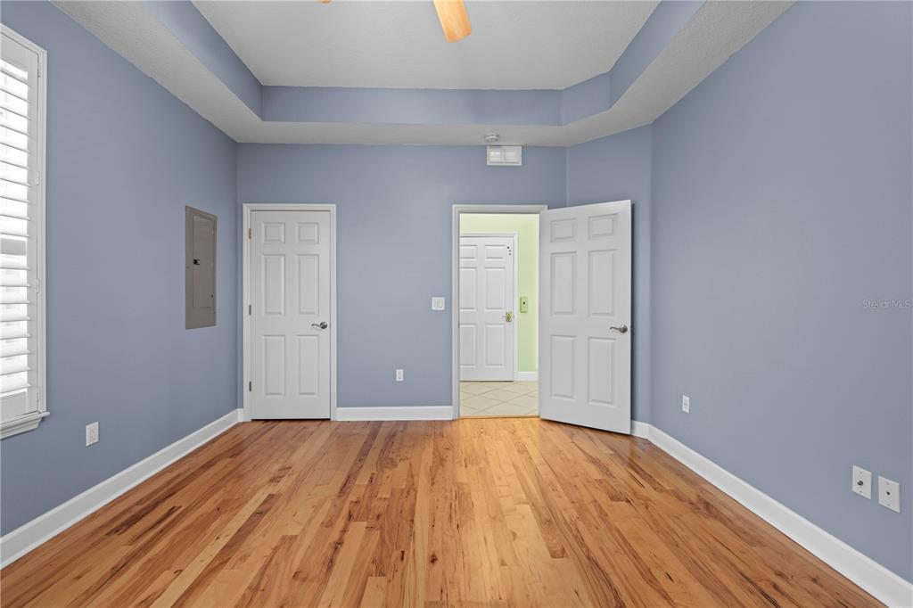 5446 Bluepoint Drive Port Richey, FL 34668 - Photo 46 of 68 a view of a room with wooden floor and white walls