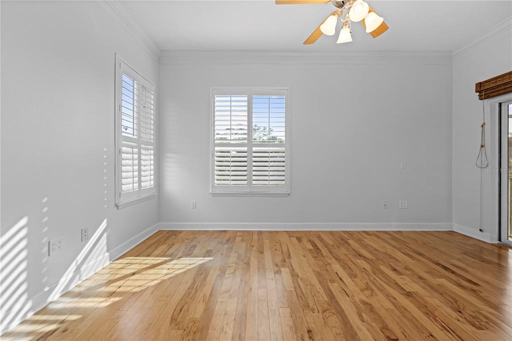 5446 Bluepoint Drive Port Richey, FL 34668 - Photo 50 of 68 a view of a room with wooden floor and windows