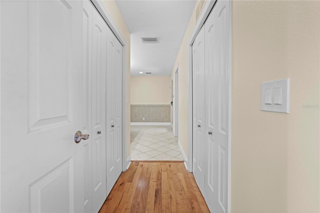 5446 Bluepoint Drive Port Richey, FL 34668 - Photo 57 of 68 a view of a hallway with wooden floor