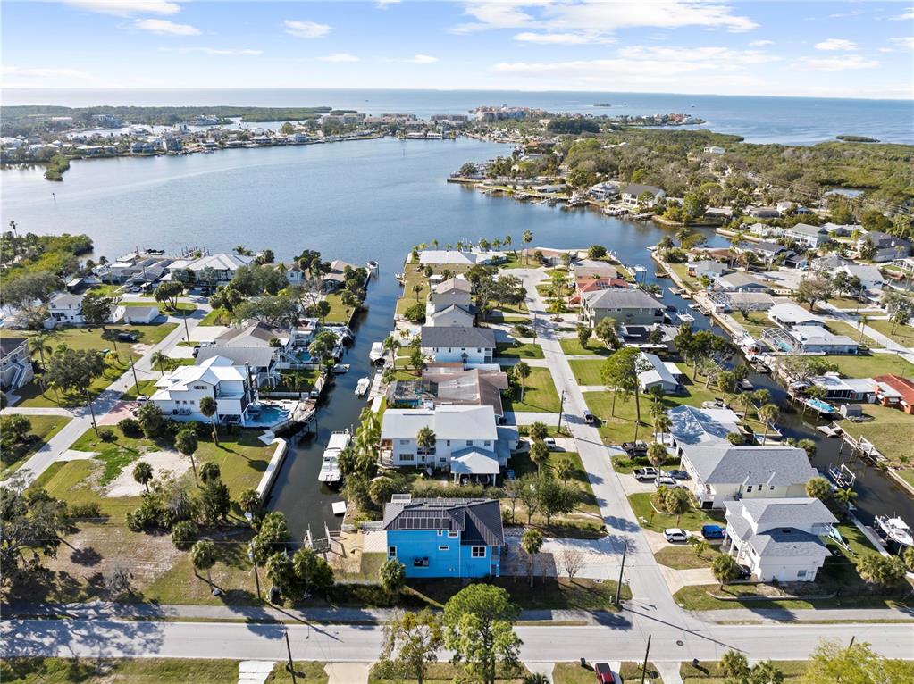 5446 Bluepoint Drive Port Richey, FL 34668 - Photo 6 of 68 an aerial view of a city with lots of residential buildings ocean and mountain view in back