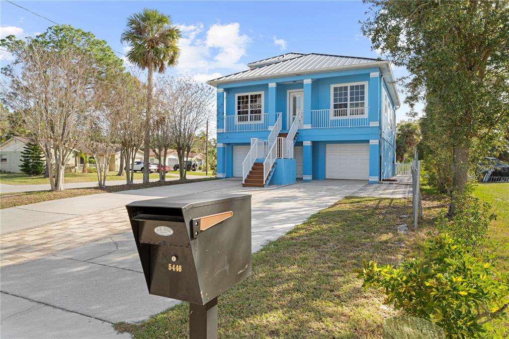 5446 Bluepoint Drive Port Richey, FL 34668 - Photo 10 of 68 a front view of a house with a yard