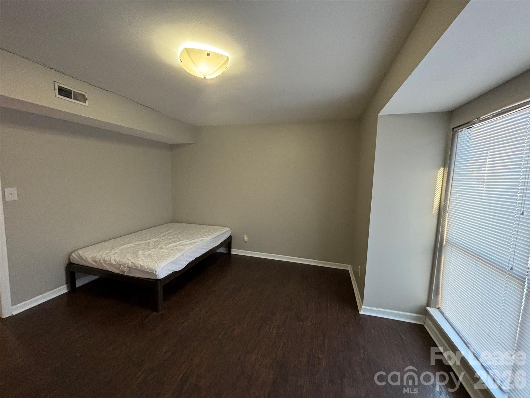 11040 Harrowfield Road Charlotte, NC 28226 - Photo 9 of 14 an empty room with windows
