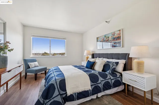 a bedroom with a bed and a lamp