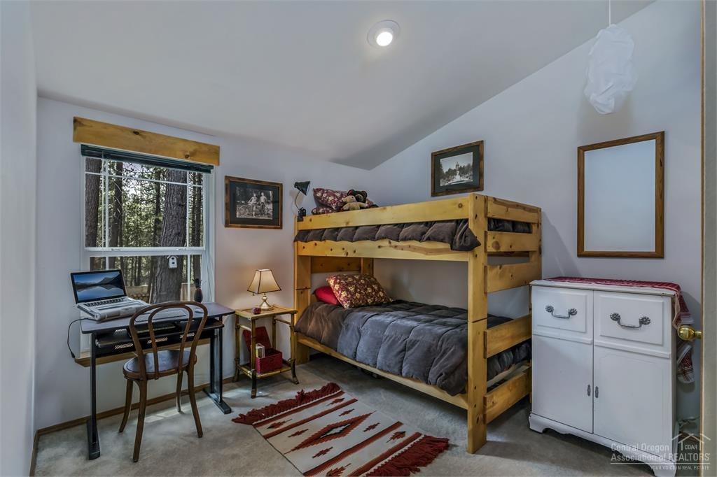 17171 Island Loop Way Bend, OR 97707 - Photo 14 of 25 a bedroom with a bed and a window