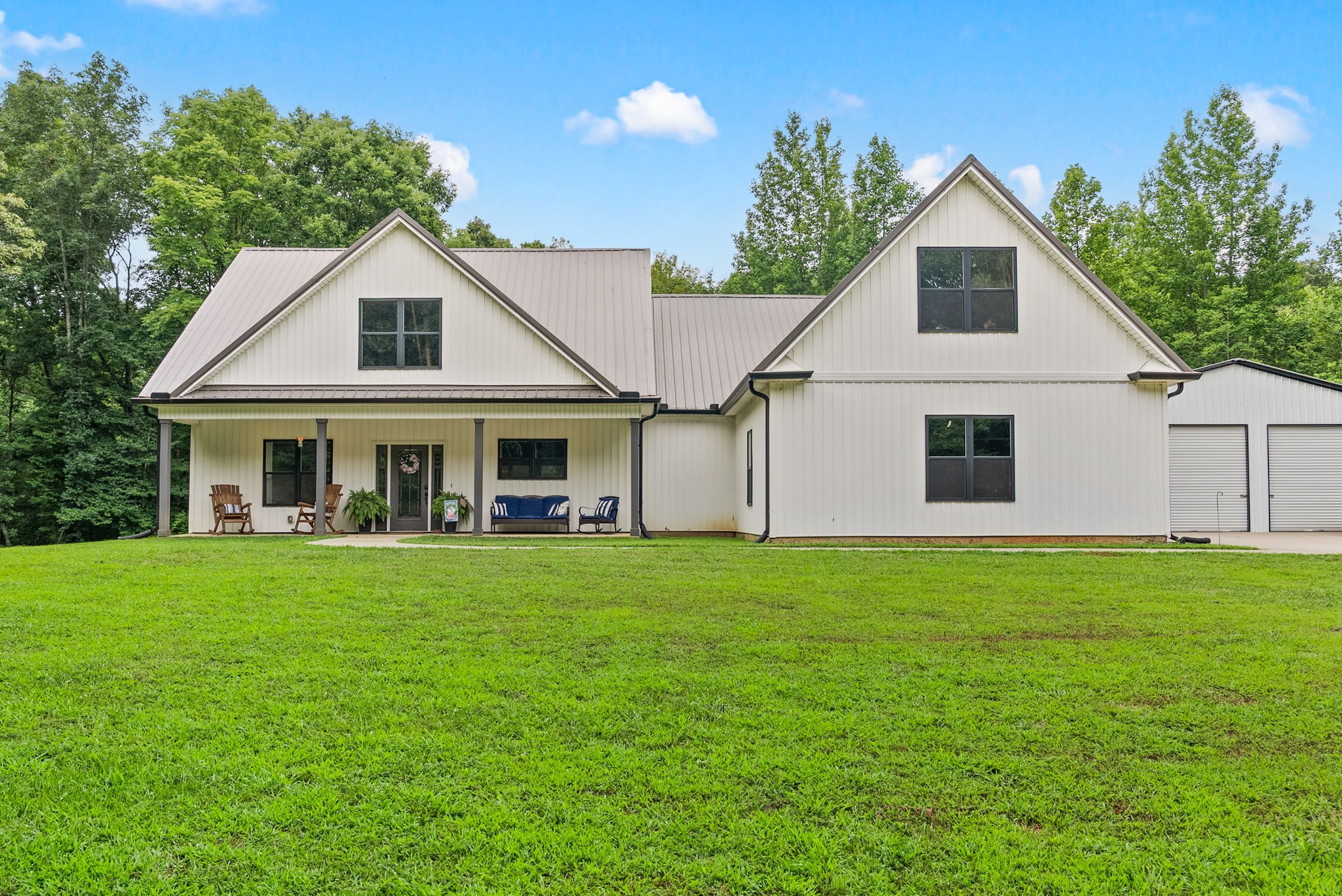 a front view of a house with a garden