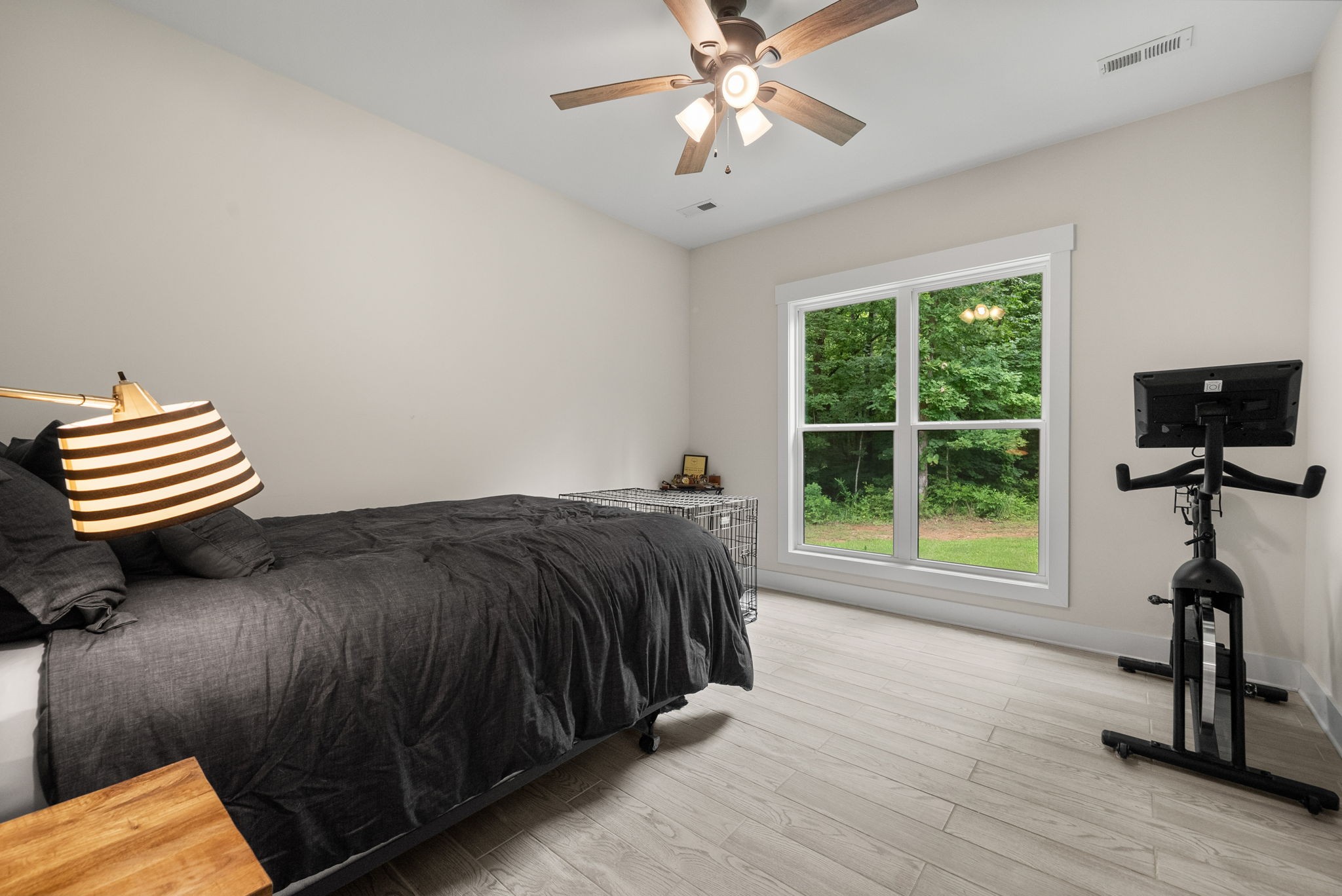 1895 Highway 13 Cunningham, TN 37052 - Photo 23 of 33 a bedroom with a bed and a chandelier