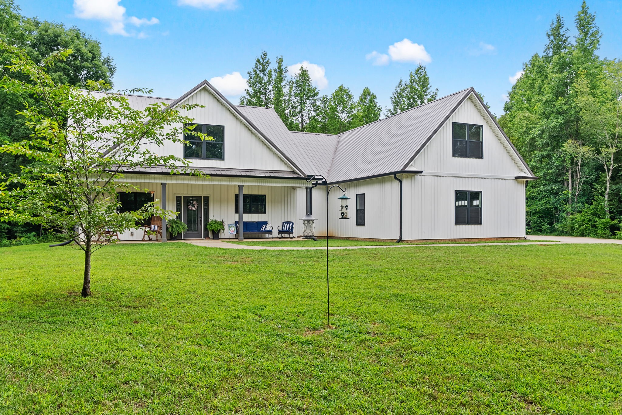 1895 Highway 13 Cunningham, TN 37052 - Photo 27 of 33 a front view of a house with a garden