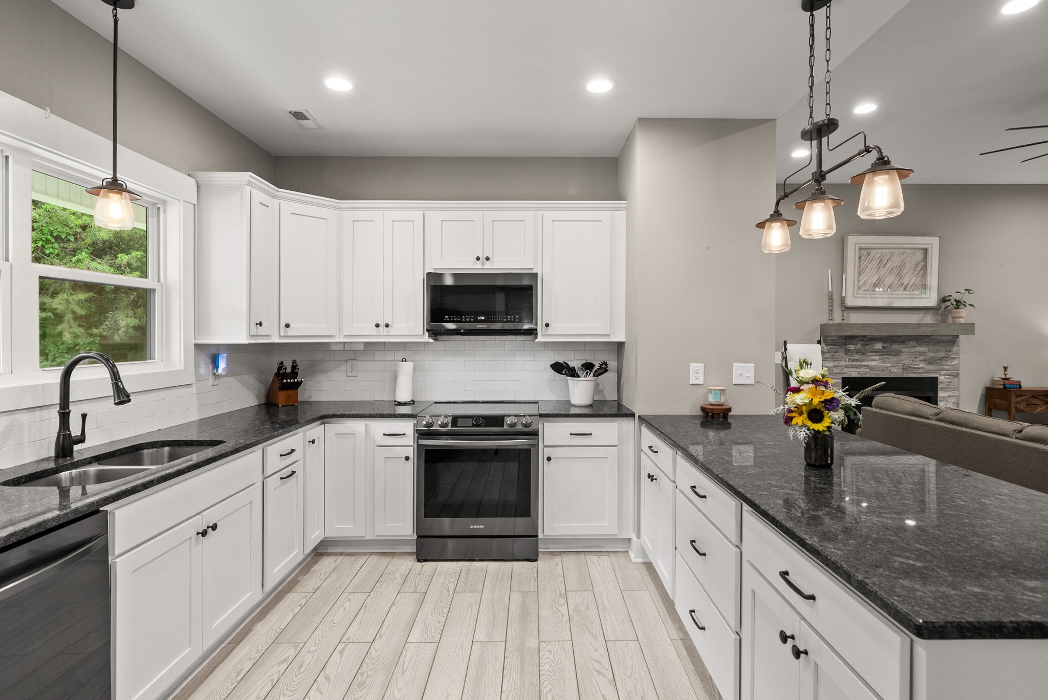 1895 Highway 13 Cunningham, TN 37052 - Photo 5 of 33 a kitchen with a sink a counter space appliances and cabinets
