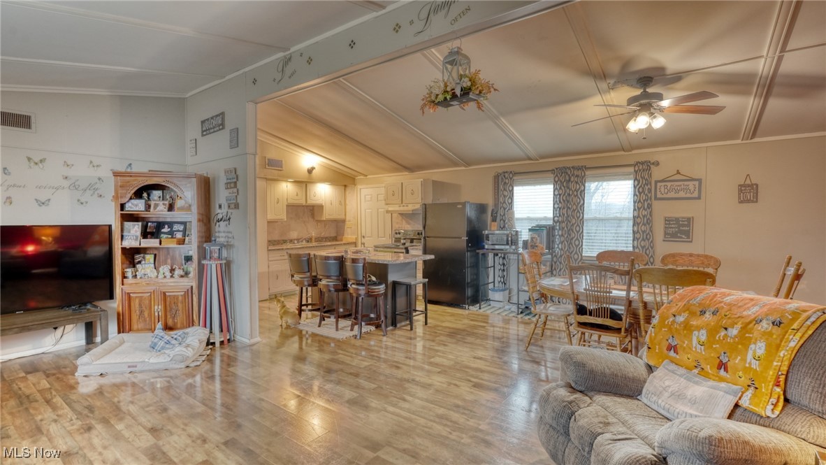 10614 Linwood Road Pleasant City, OH 43772 - Photo 6 of 48 Living room with a ceiling fan and light wood-style floors