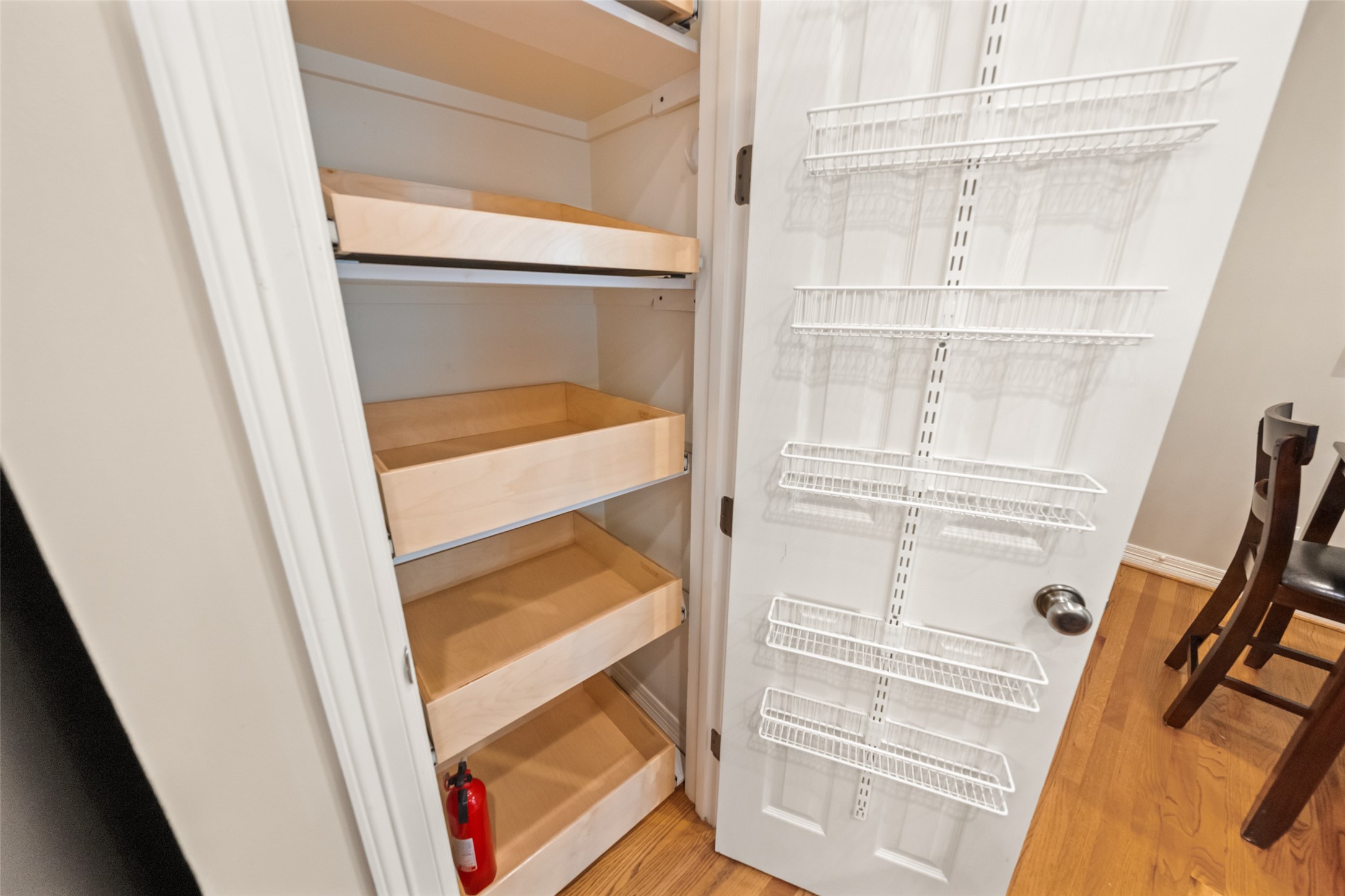 2708 Wroxton Road West University Place, TX 77005 - Photo 18 of 22 This pantry features custom ShelfGenie pull-out drawers for optimal storage.