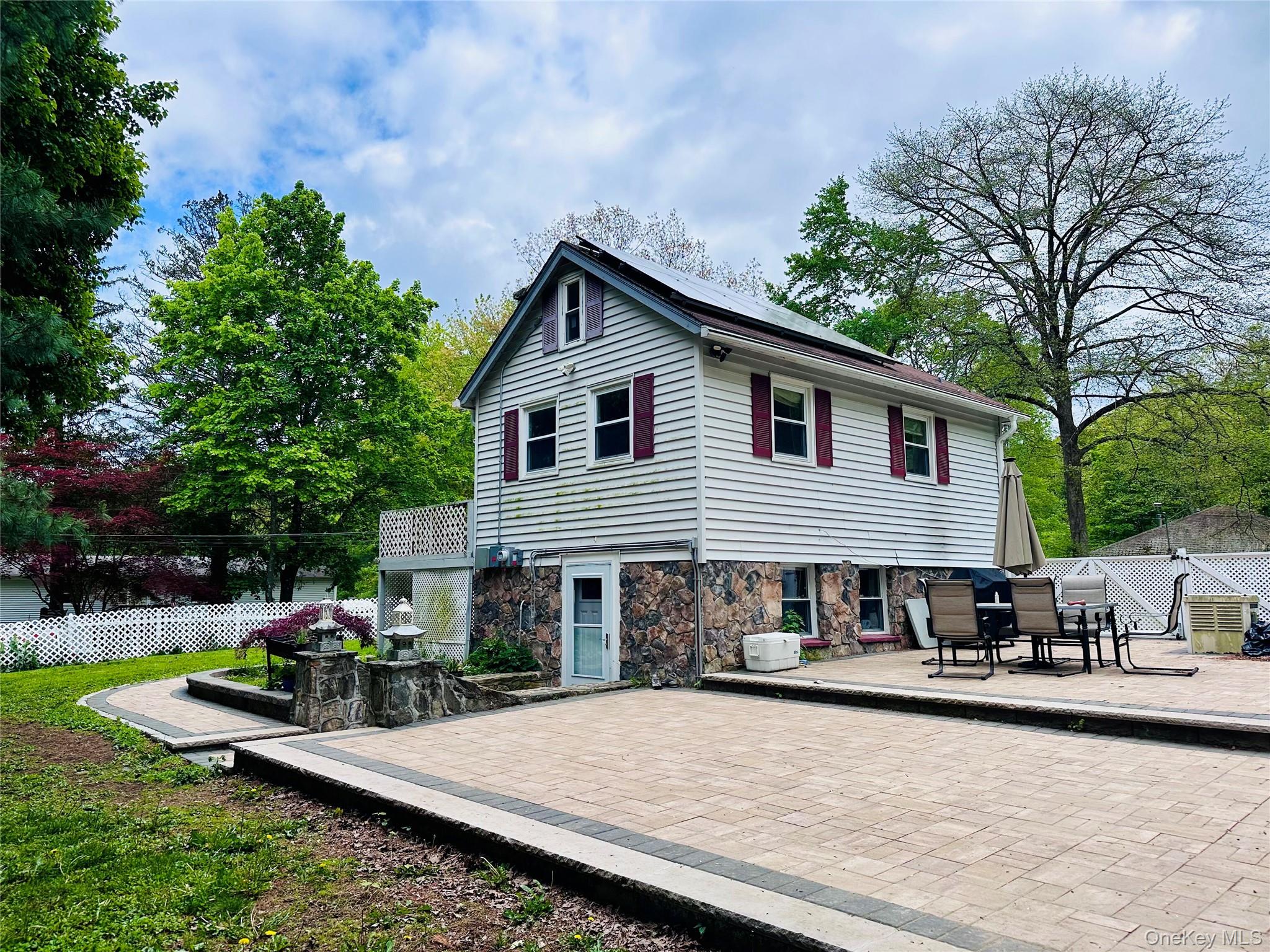 15 Pops Road Cortlandt Manor, NY 10567 - Photo 5 of 14 a front view of house with yard and trees in the background
