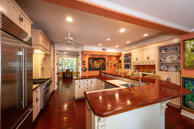 a bathroom with a sink and mirror with toilet