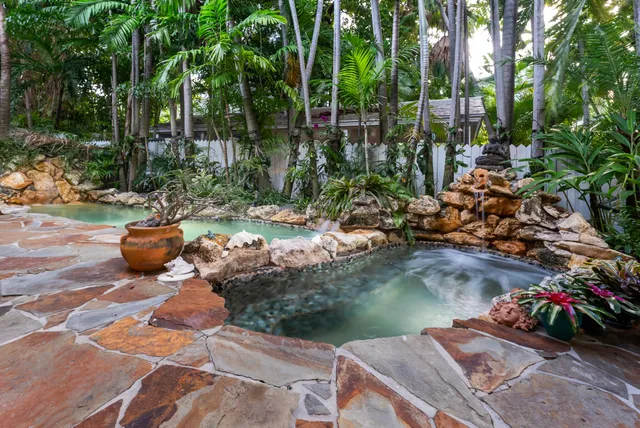 a view of a balcony with furniture and wooden floor