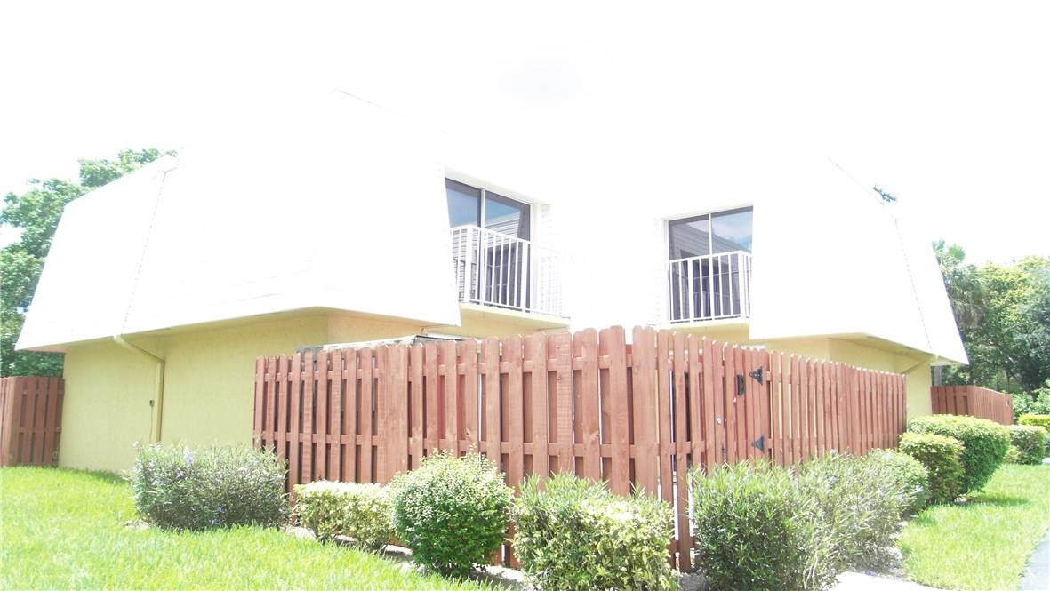 22188 Boca Rancho Drive, Unit D Boca Raton, FL 33428 - Photo 1 of 22 a view of a backyard with garden