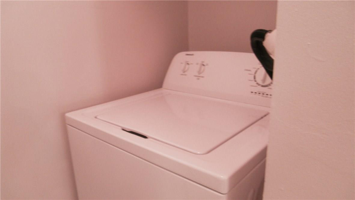 22188 Boca Rancho Drive, Unit D Boca Raton, FL 33428 - Photo 18 of 22 a utility room with dryer and washer