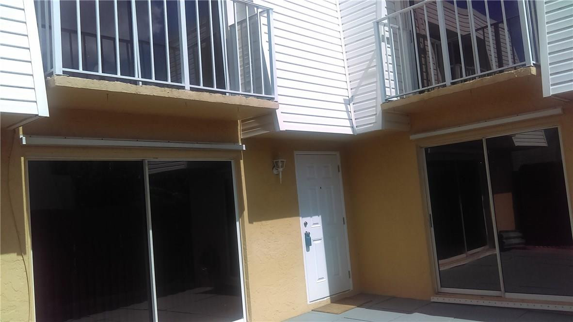 22188 Boca Rancho Drive, Unit D Boca Raton, FL 33428 - Photo 7 of 22 a view of porch with a door and chair