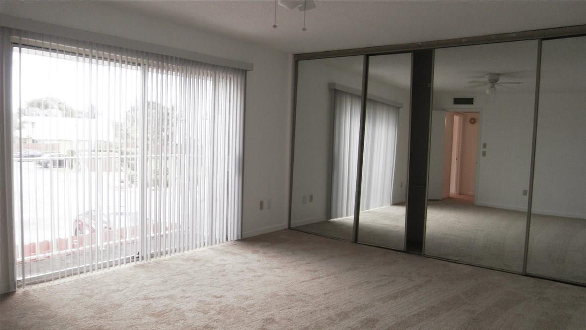 22188 Boca Rancho Drive, Unit D Boca Raton, FL 33428 - Photo 9 of 22 a view of empty room with floor to ceiling window