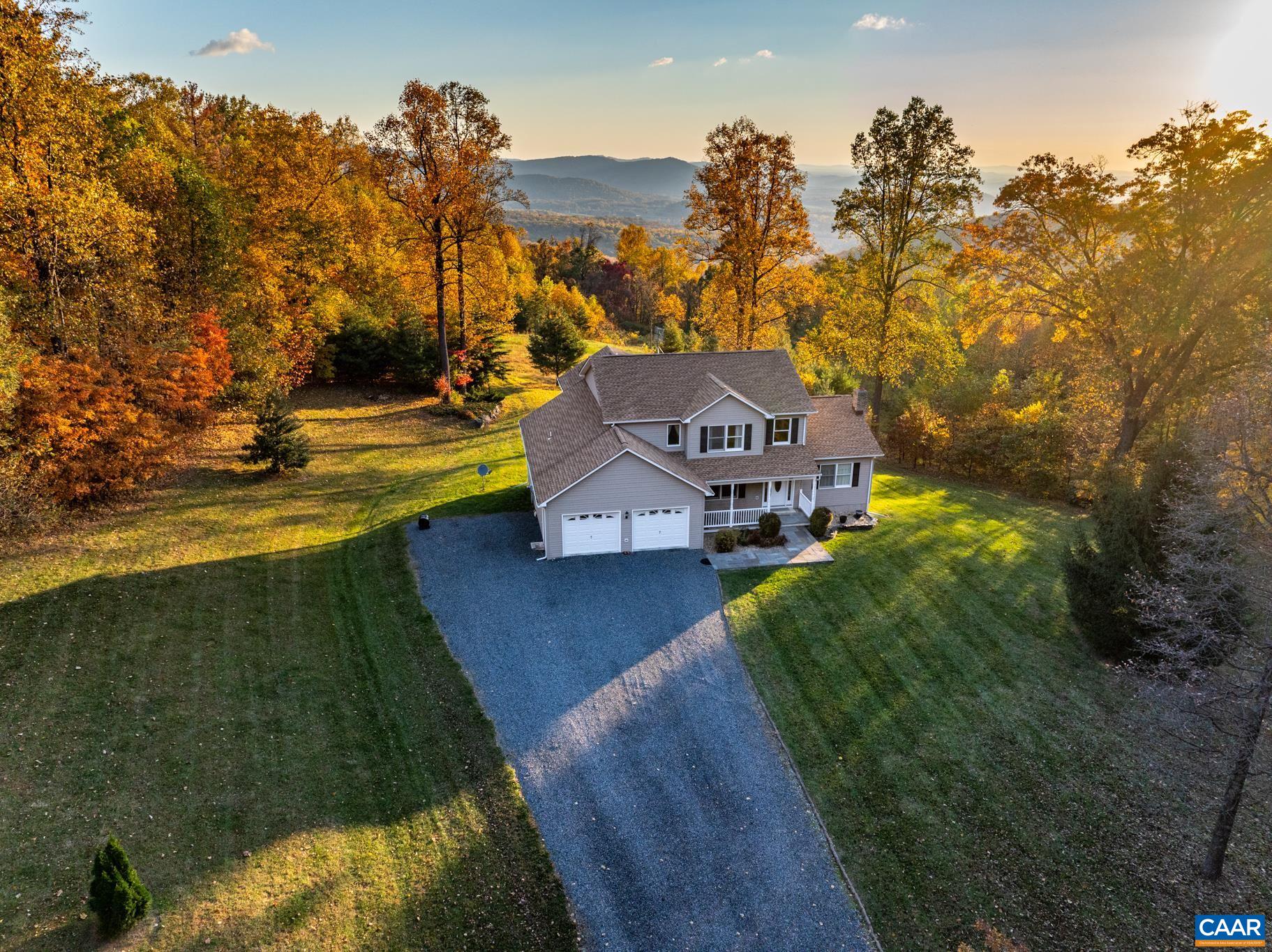 654 Saddleback Road Stanardsville, VA 22973 - Photo 1 of 75 a view of a house with a yard