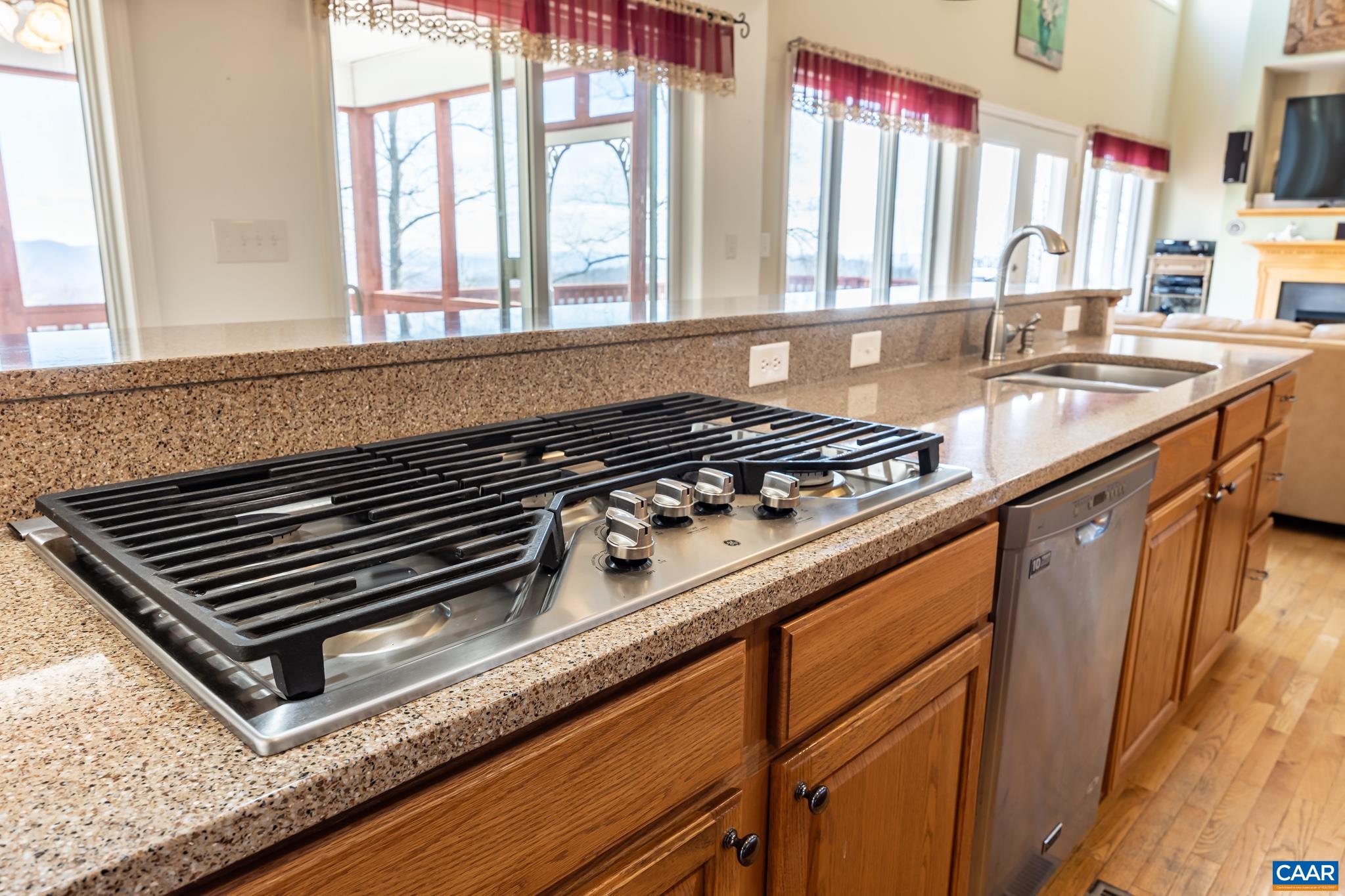 654 Saddleback Road Stanardsville, VA 22973 - Photo 13 of 75 a close view of a sink a counter space and a stove top oven