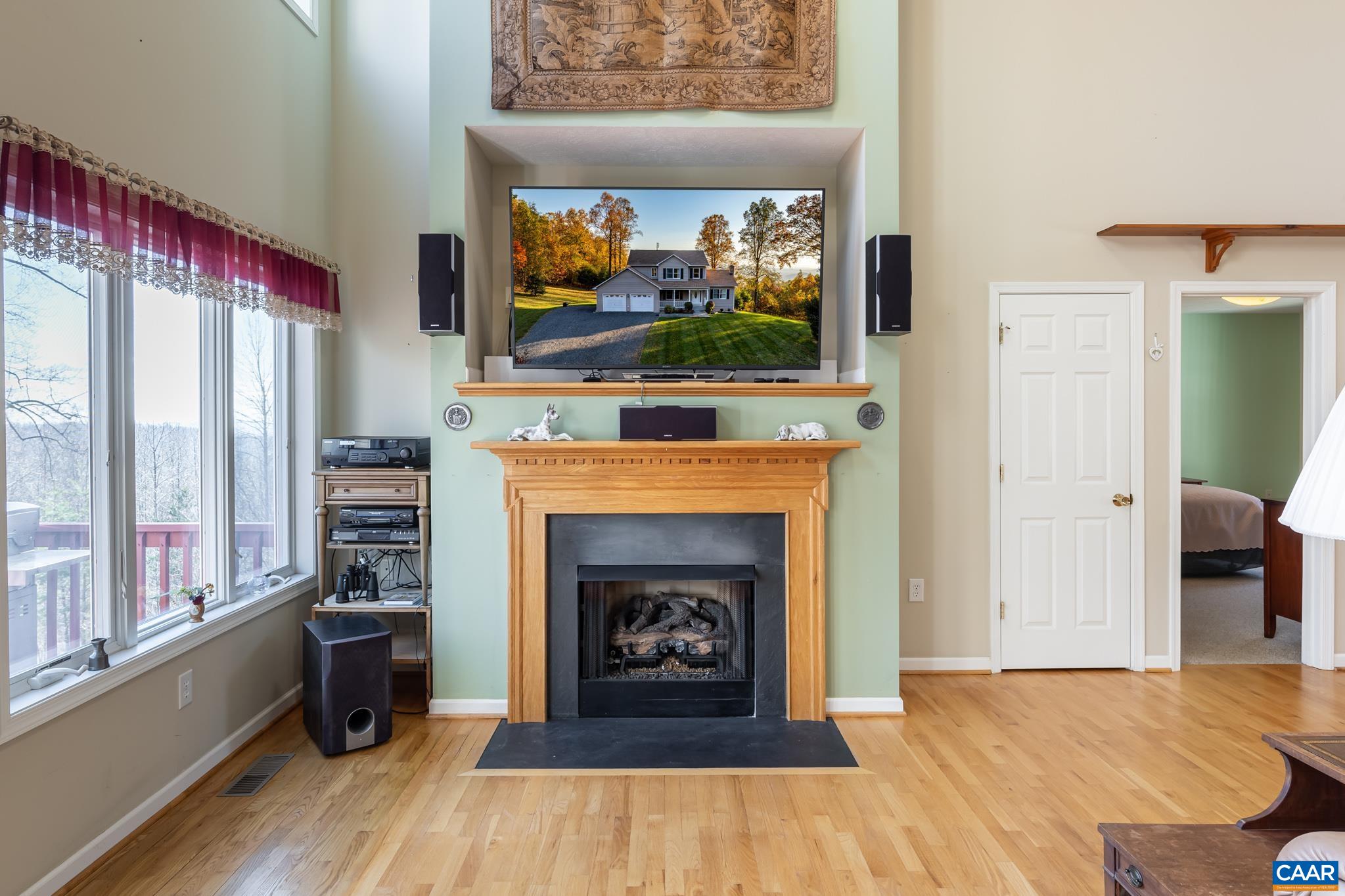 654 Saddleback Road Stanardsville, VA 22973 - Photo 16 of 75 a view of an empty room with furniture and a fireplace