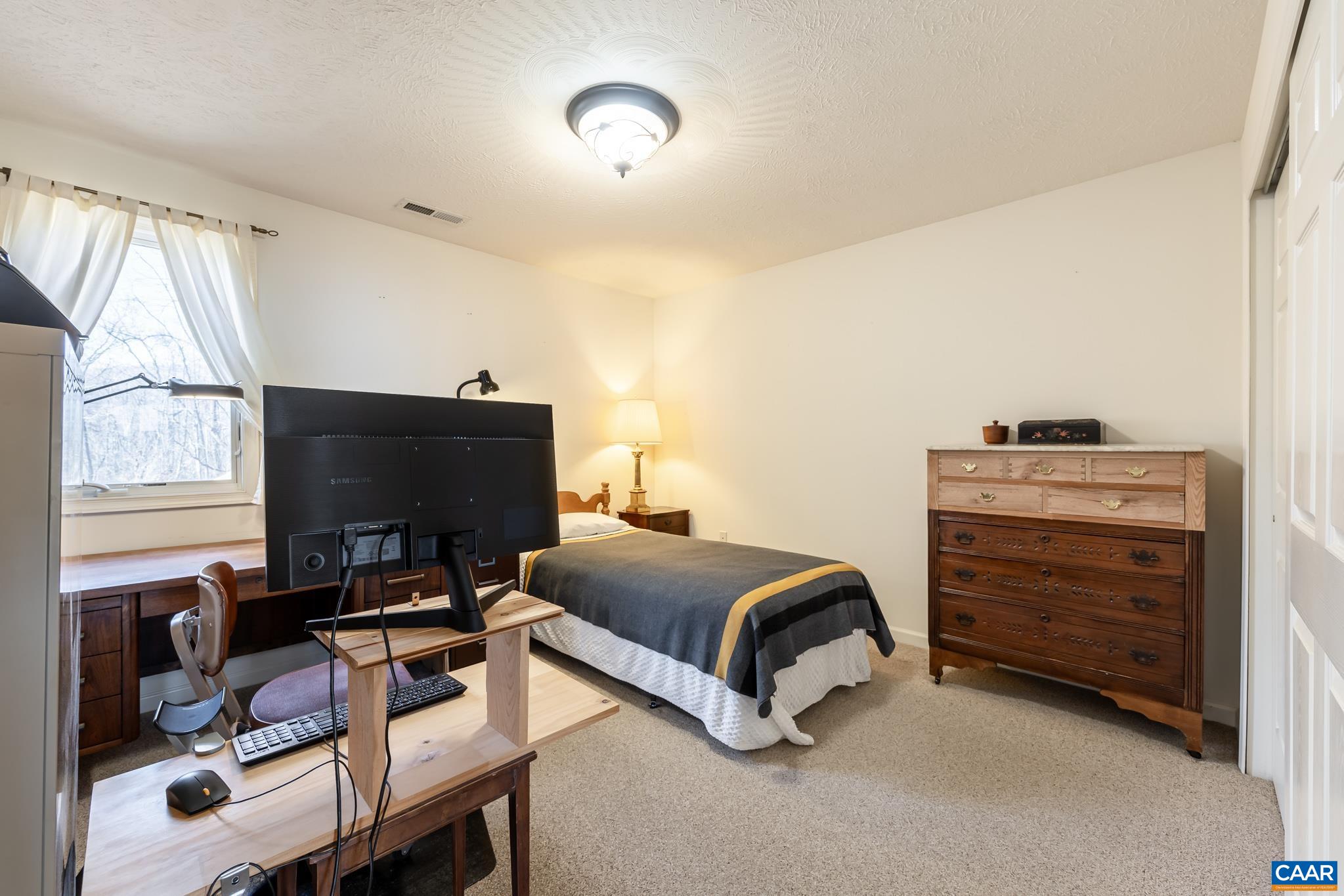 654 Saddleback Road Stanardsville, VA 22973 - Photo 37 of 75 a living room with furniture and a flat screen tv