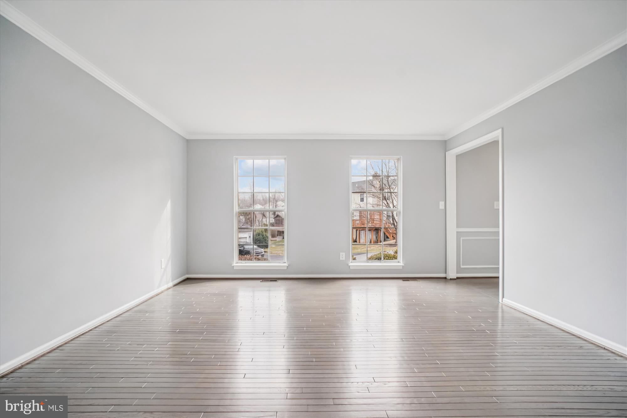 12318 Valley High Road Herndon, VA 20170 - Photo 13 of 56 a view of an empty room with wooden floor and a window