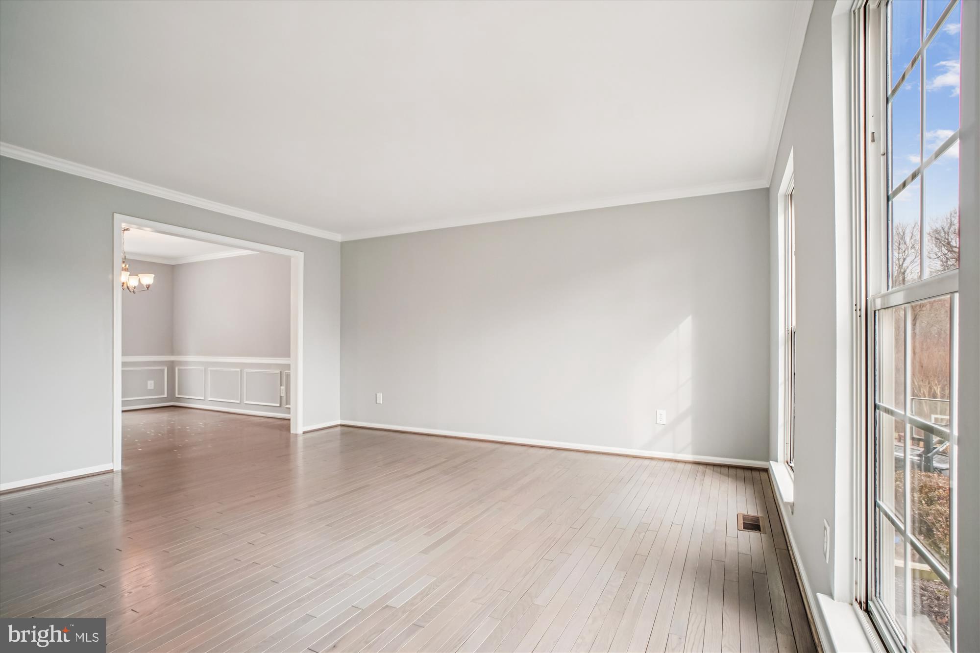 12318 Valley High Road Herndon, VA 20170 - Photo 14 of 56 an empty room with wooden floor and windows