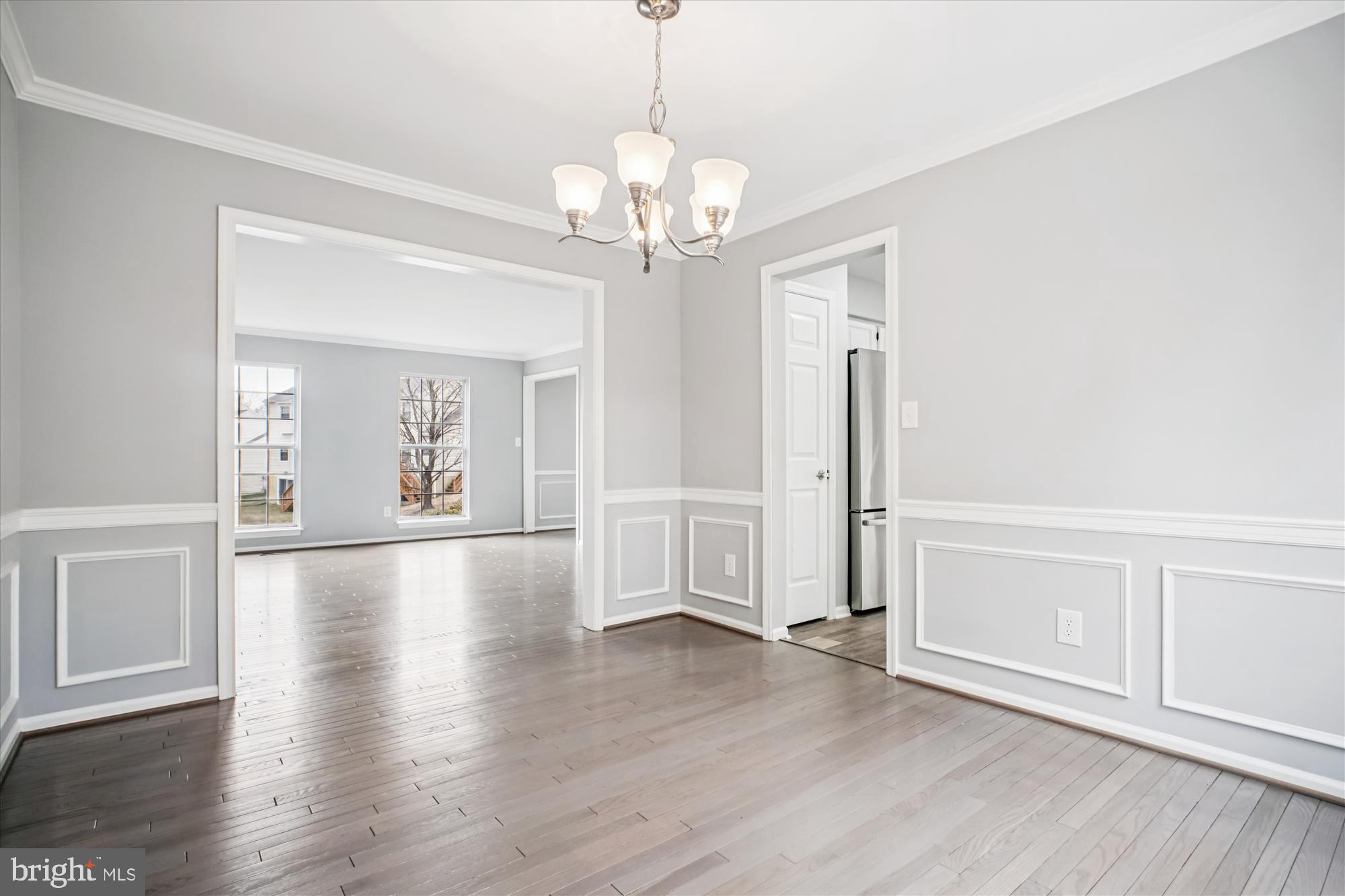 12318 Valley High Road Herndon, VA 20170 - Photo 15 of 56 a view of an empty room with window and wooden floor