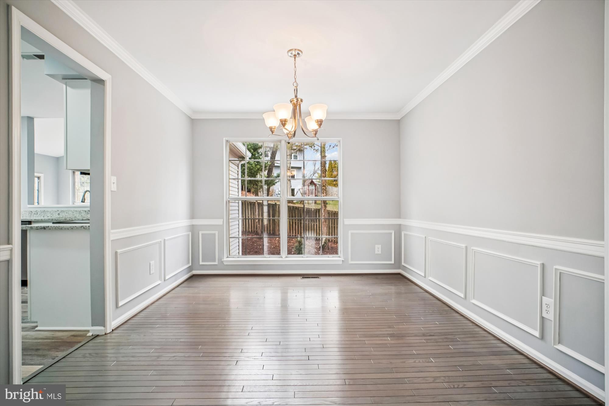 12318 Valley High Road Herndon, VA 20170 - Photo 16 of 56 a view of an empty room with wooden floor and a window
