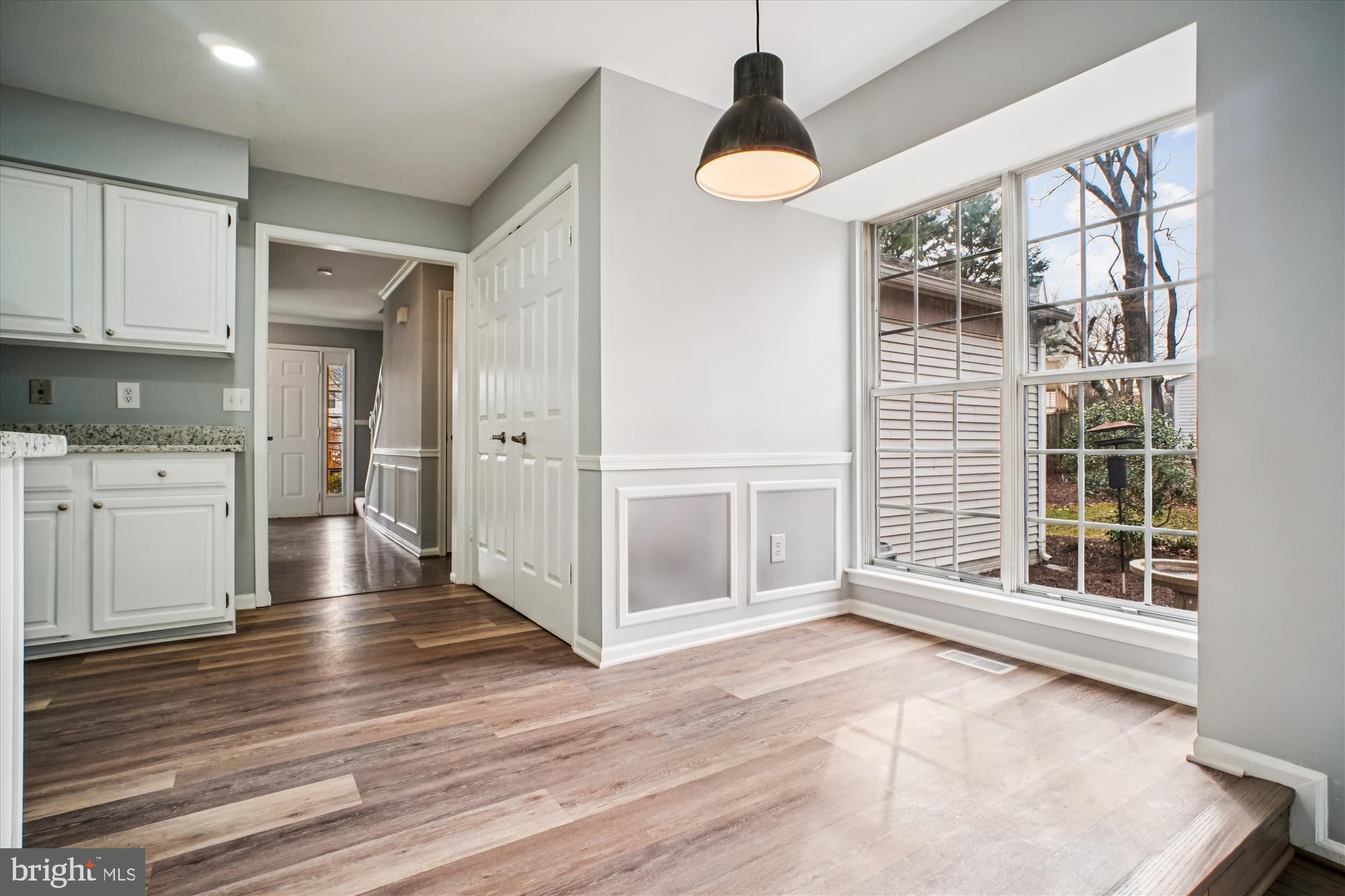 12318 Valley High Road Herndon, VA 20170 - Photo 21 of 56 an empty room with wooden floor and windows