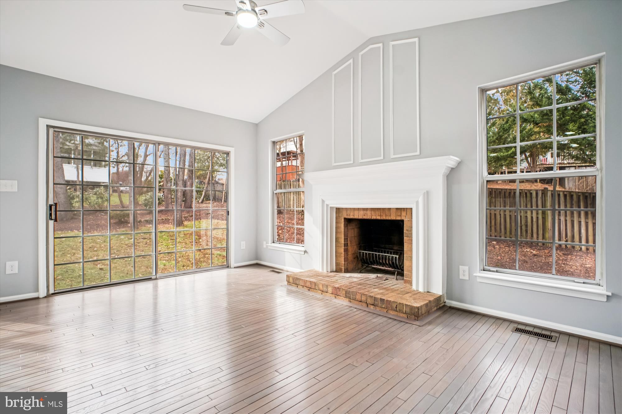 12318 Valley High Road Herndon, VA 20170 - Photo 24 of 56 a view of an empty room with wooden floor and a window