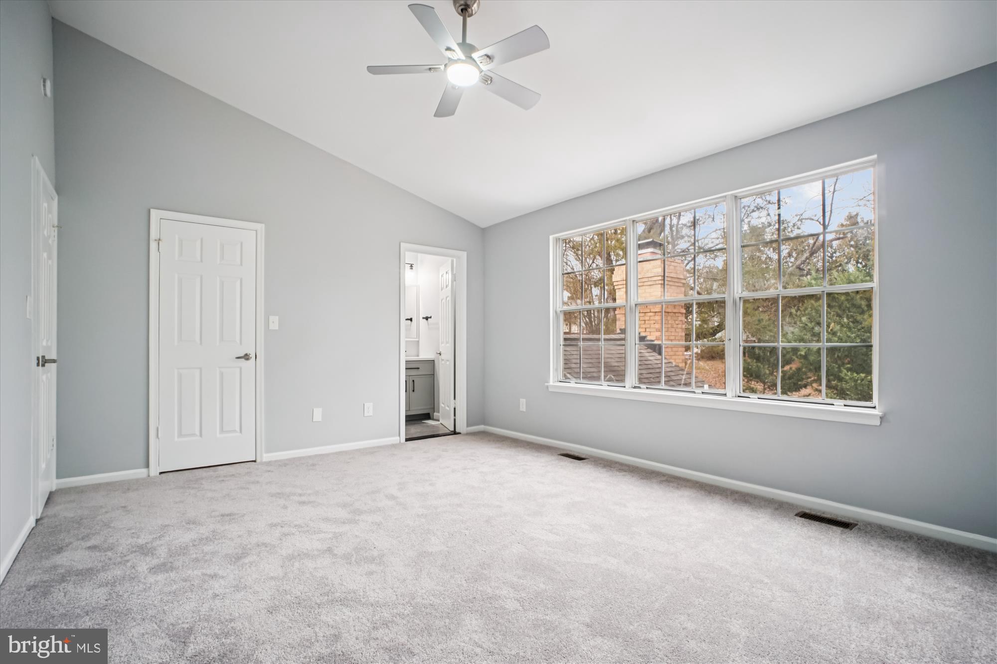 12318 Valley High Road Herndon, VA 20170 - Photo 30 of 56 an empty room with chandelier fan and windows