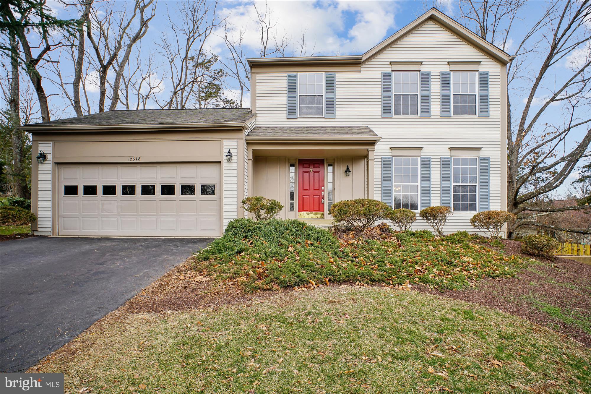 12318 Valley High Road Herndon, VA 20170 - Photo 3 of 56 a front view of a house with garden
