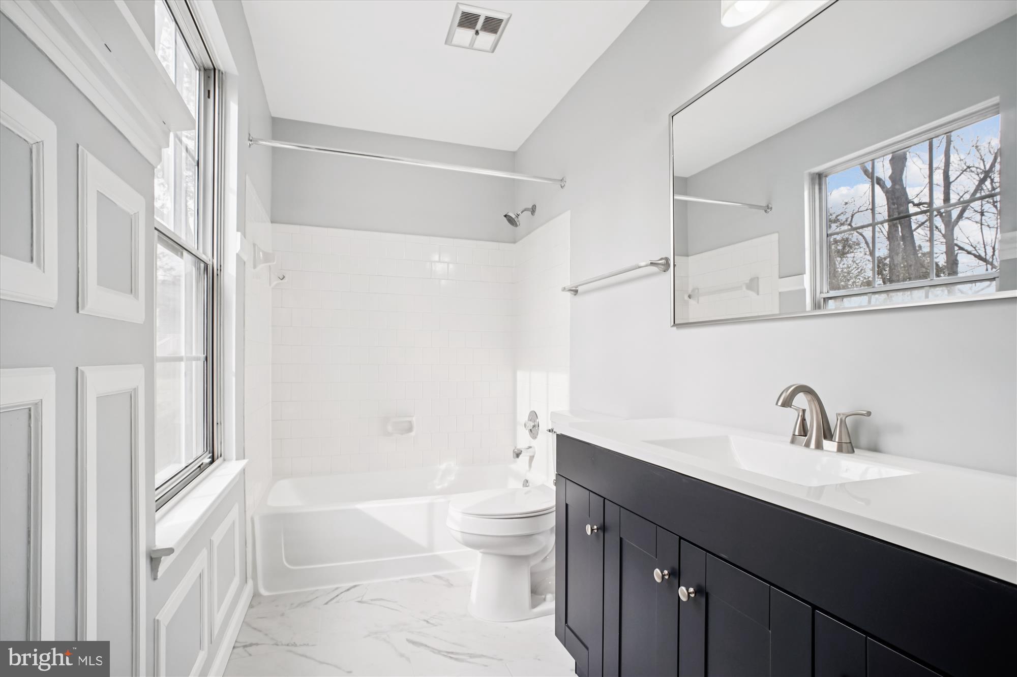 12318 Valley High Road Herndon, VA 20170 - Photo 37 of 56 a bathroom with a sink a toilet and a bathtub