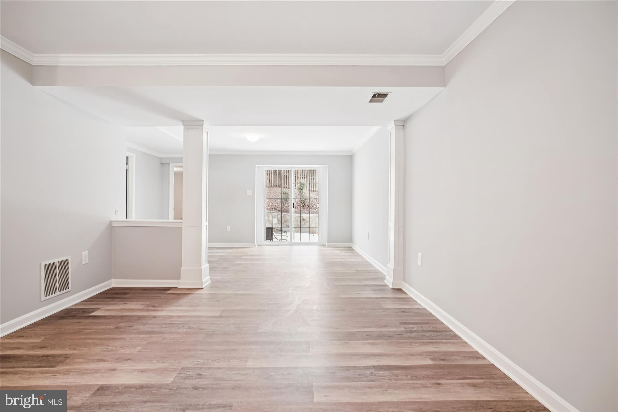 12318 Valley High Road Herndon, VA 20170 - Photo 41 of 56 a view of an empty room with wooden floor and a window