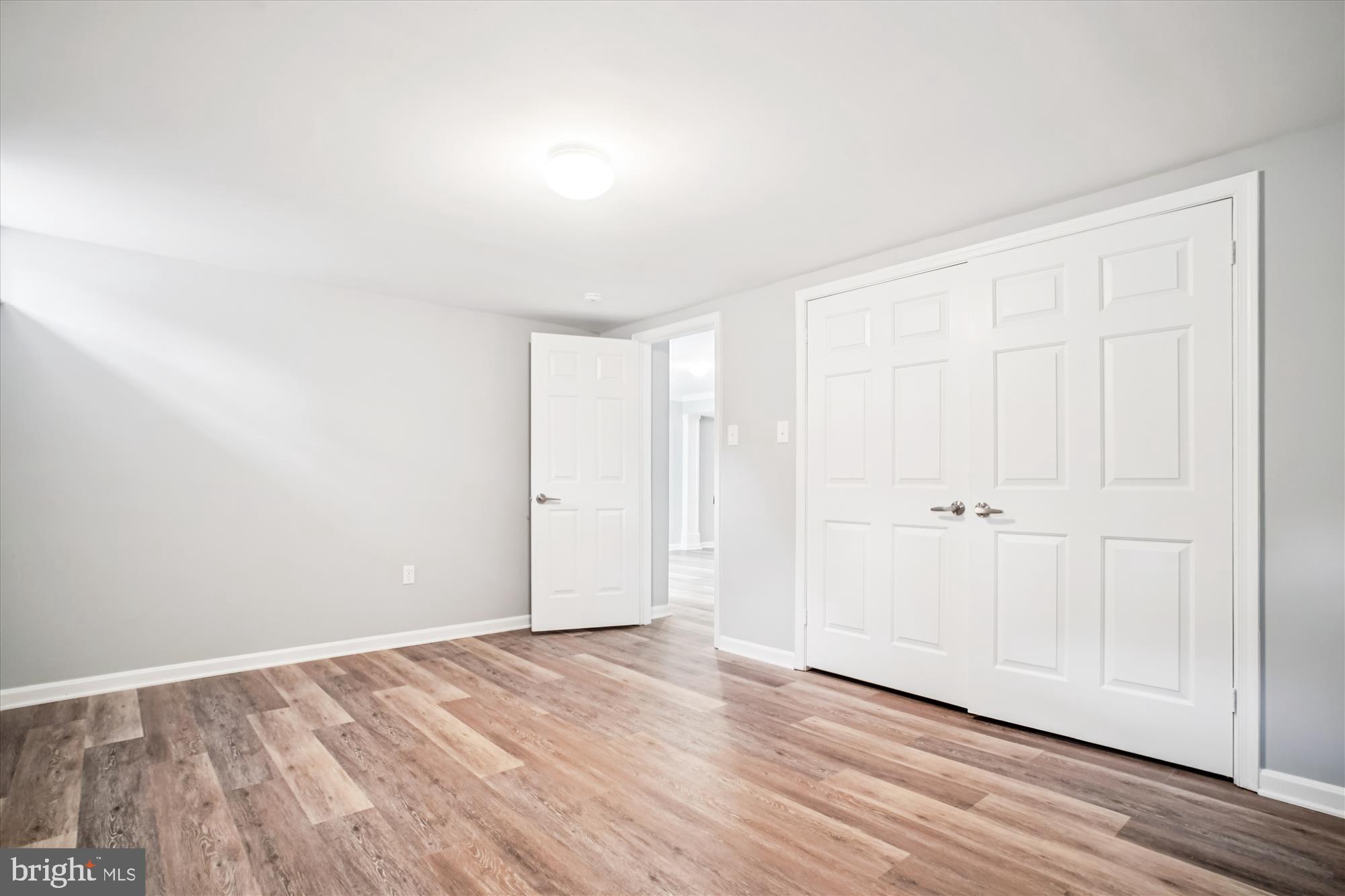 12318 Valley High Road Herndon, VA 20170 - Photo 44 of 56 a view of an empty room and wooden floor