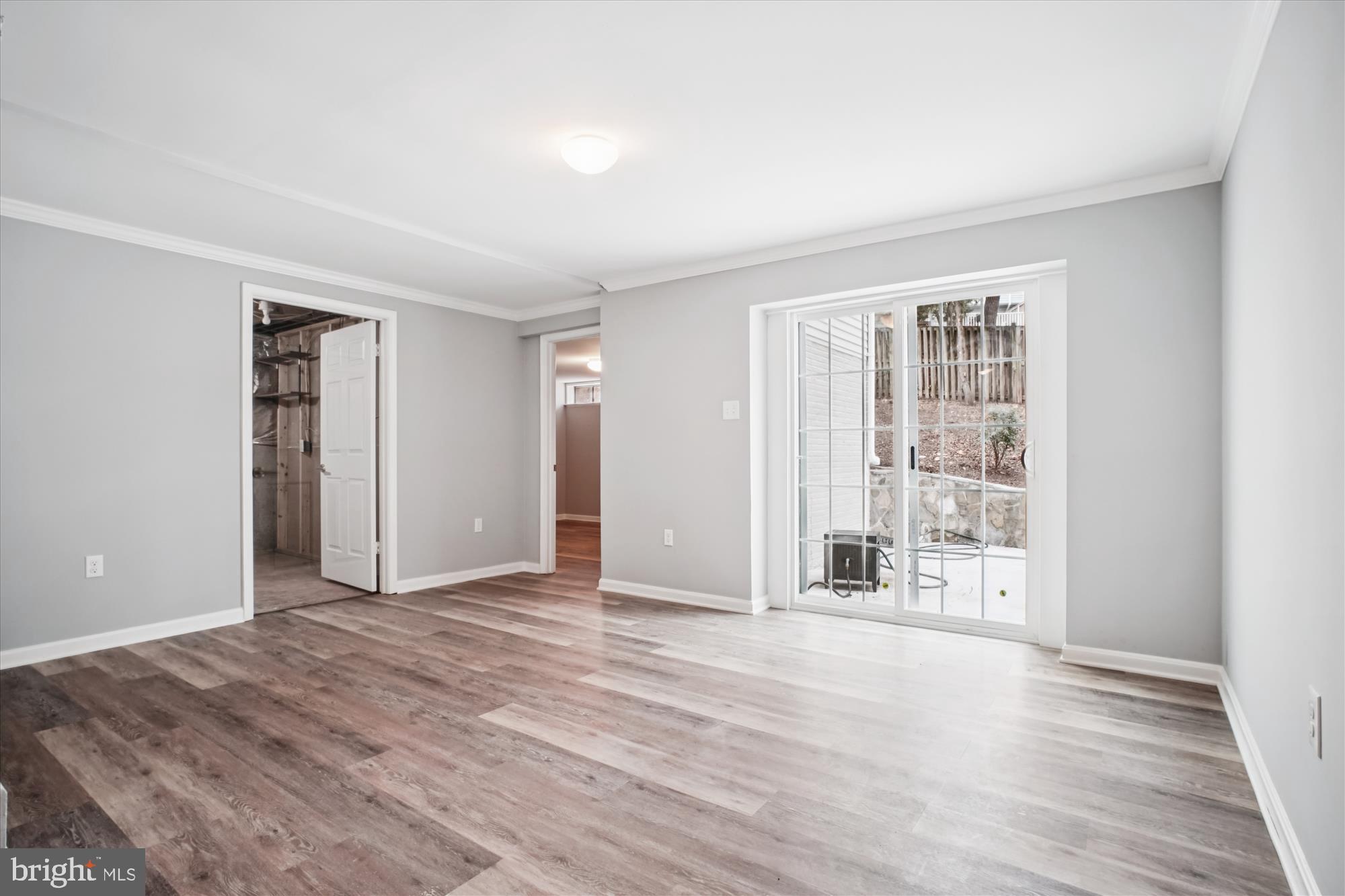 12318 Valley High Road Herndon, VA 20170 - Photo 46 of 56 an empty room with wooden floor and windows