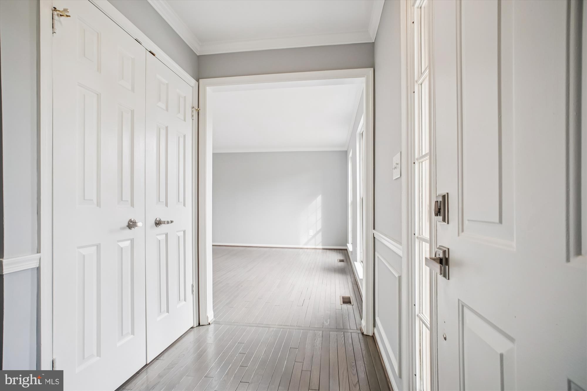 12318 Valley High Road Herndon, VA 20170 - Photo 10 of 56 a view of a hallway with wooden floor and closet area