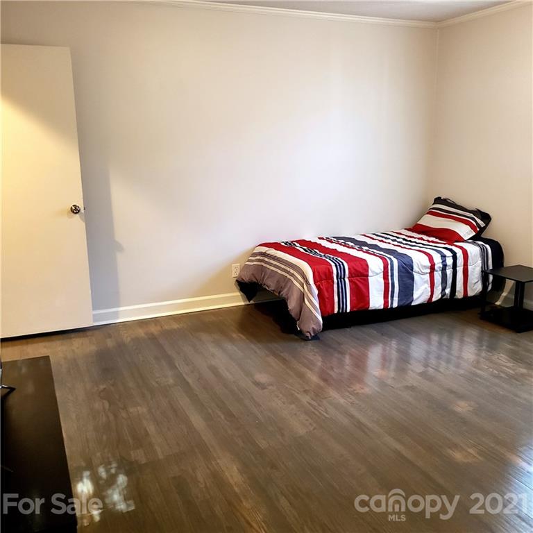 502 Roy Eaker Road Cherryville, NC 28021 - Photo 12 of 22 a bedroom with a bed and a night stand