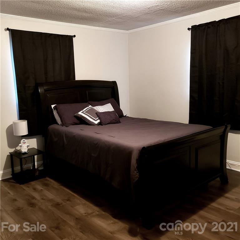 502 Roy Eaker Road Cherryville, NC 28021 - Photo 15 of 22 a bedroom with a bed and a dresser