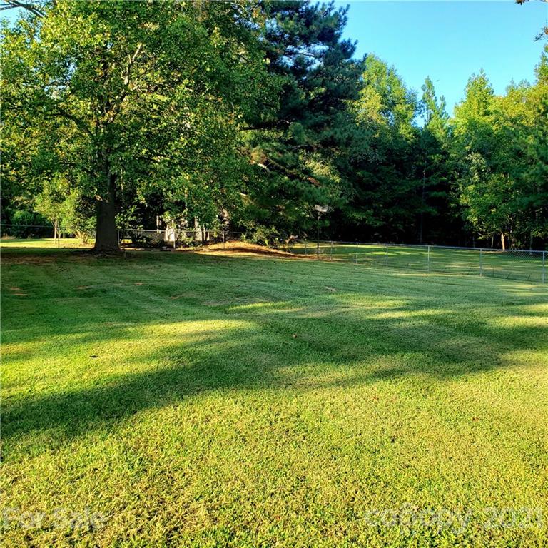 502 Roy Eaker Road Cherryville, NC 28021 - Photo 22 of 22 a big yard with lots of green space and trees