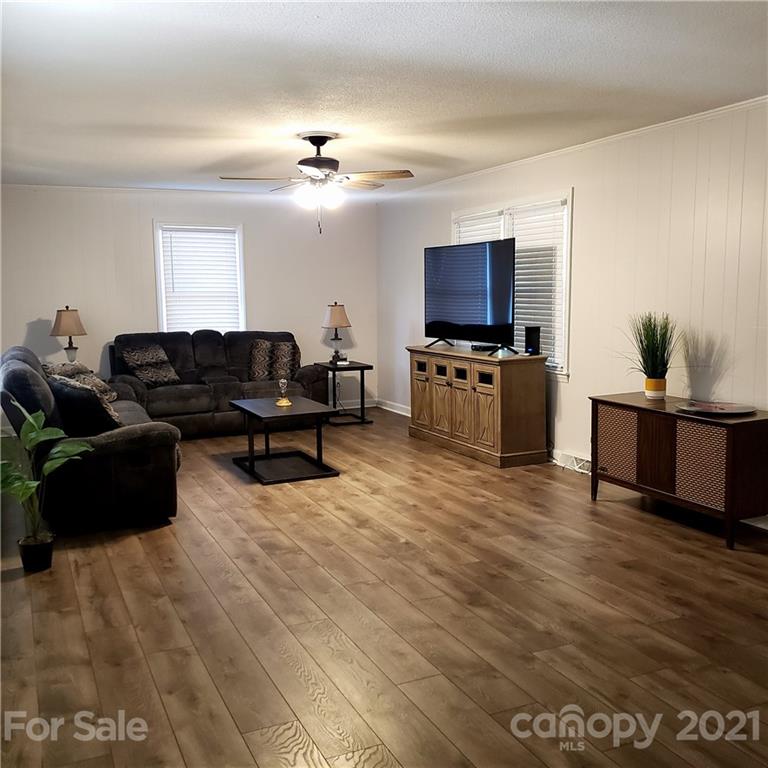 502 Roy Eaker Road Cherryville, NC 28021 - Photo 4 of 22 a living room with furniture and a flat screen tv