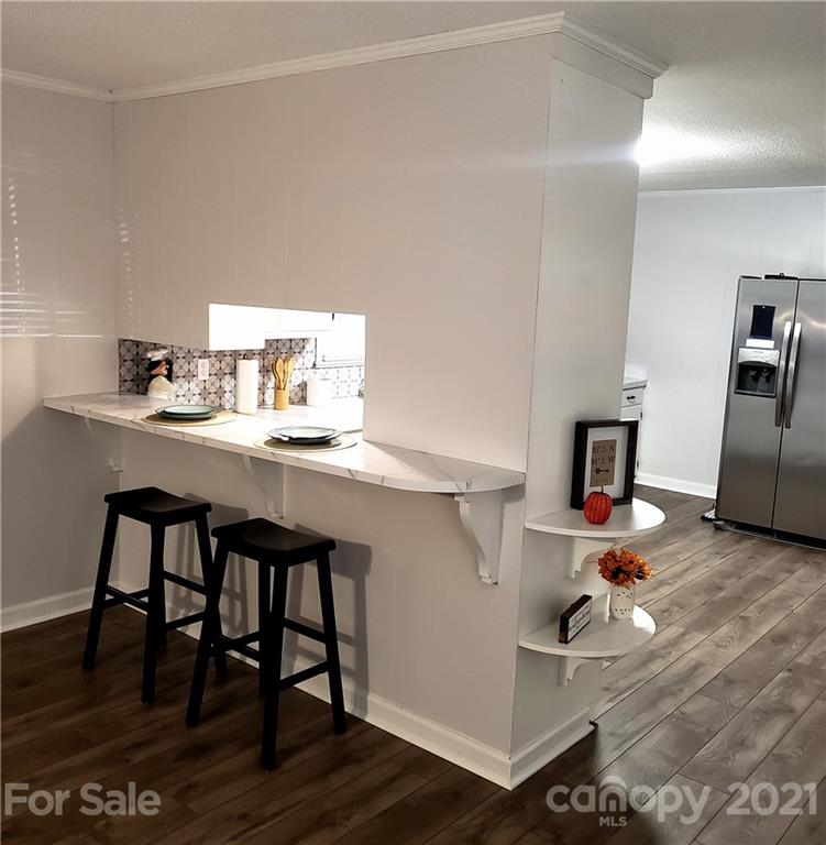 502 Roy Eaker Road Cherryville, NC 28021 - Photo 5 of 22 a kitchen with a sink cabinets and wooden floor