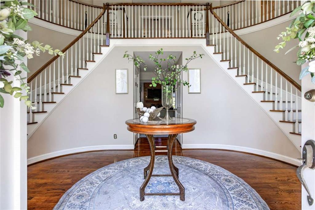 3035 Mt Zion Road Oxford, GA 30054 - Photo 22 of 99 a view of a hallway with wooden floor table and chairs