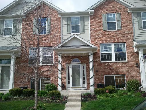 2482 Emily Lane Elgin, IL 60124 - Photo 1 of 10 a front view of a house with garden