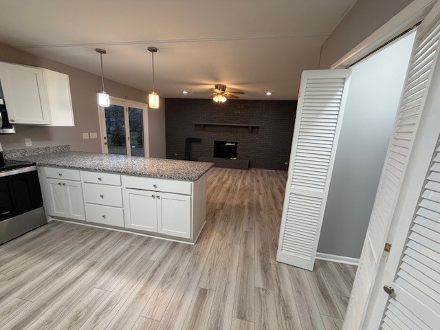 607 Adams Street Manchester, TN 37355 - Photo 4 of 14 a kitchen with a sink dishwasher and wooden floor