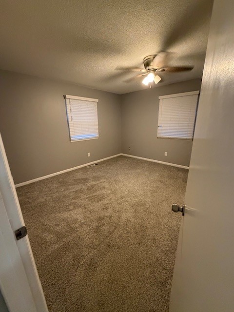 607 Adams Street Manchester, TN 37355 - Photo 7 of 14 en empty room with windows and fan