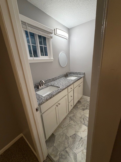 607 Adams Street Manchester, TN 37355 - Photo 8 of 14 a bathroom with a granite countertop sink and a mirror