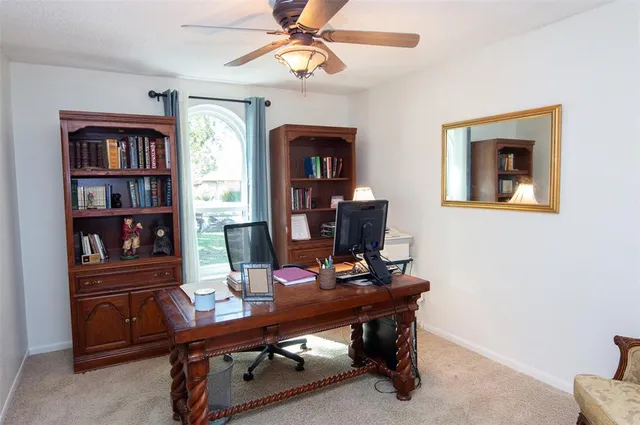 a view of a workspace with furniture