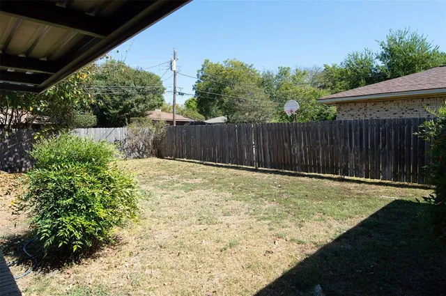 a swimming pool with wooden fence